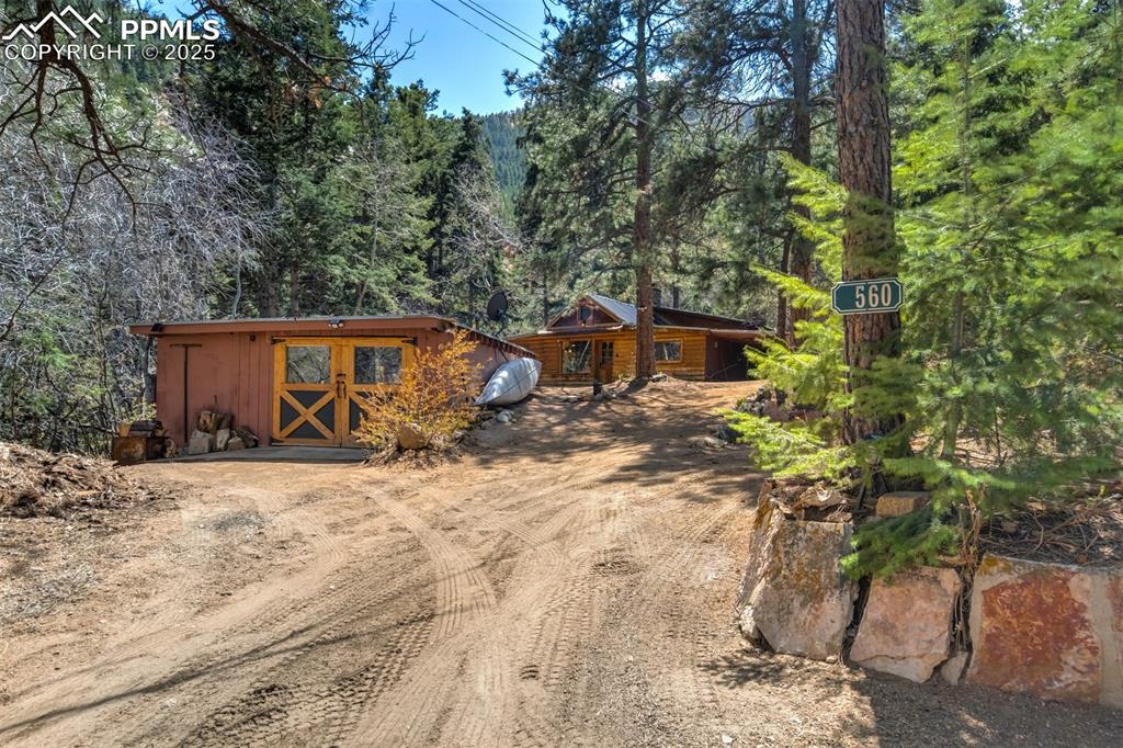 4560 Canonwood Road Colorado Springs, CO 80906 - Photo 50 of 50 a view of a house with a yard