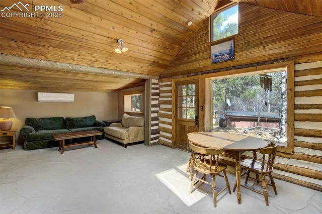 a livingroom with furniture and a large window