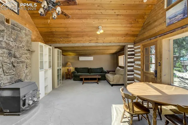 a dining room with furniture and a fireplace