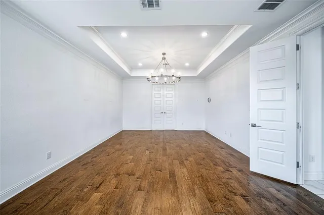 a bathroom with a granite countertop bathtub sink vanity and mirror