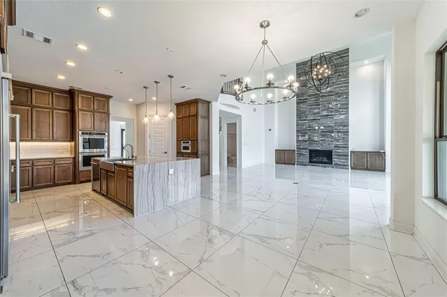 a view of an empty room with a ceiling fan