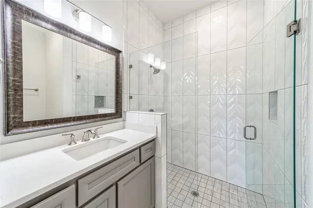 a kitchen with kitchen island granite countertop a refrigerator stove top oven and sink