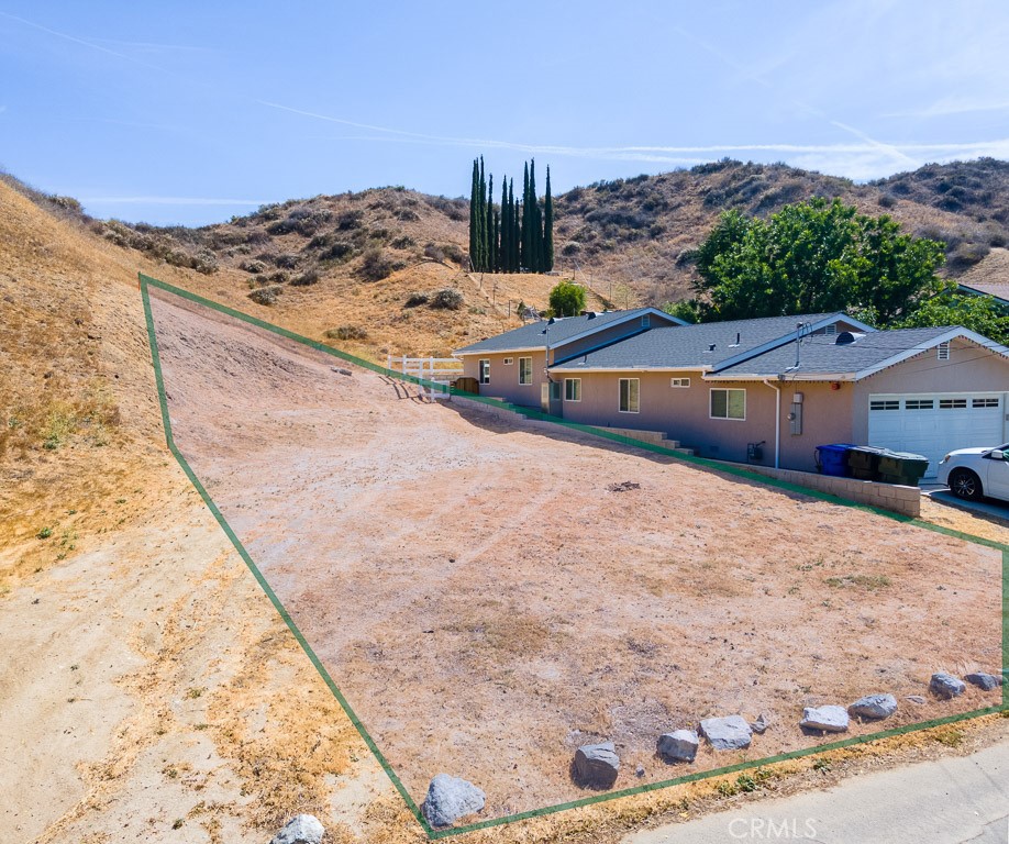 0 Driver Val Verde, CA 91384 - Photo 3 of 7 a view of houses with sky view