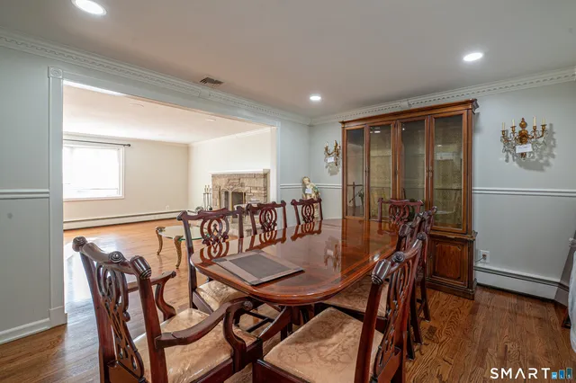 a view of a dining room with furniture and wooden floor