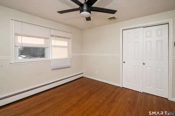 a view of a livingroom with furniture and a garage