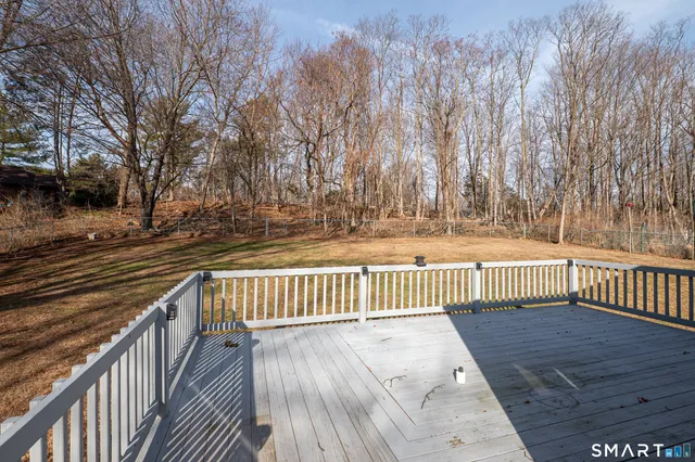 a view of deck with wooden floor and fence