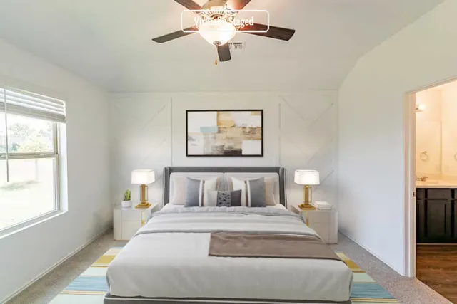 a bedroom with a bed and a window