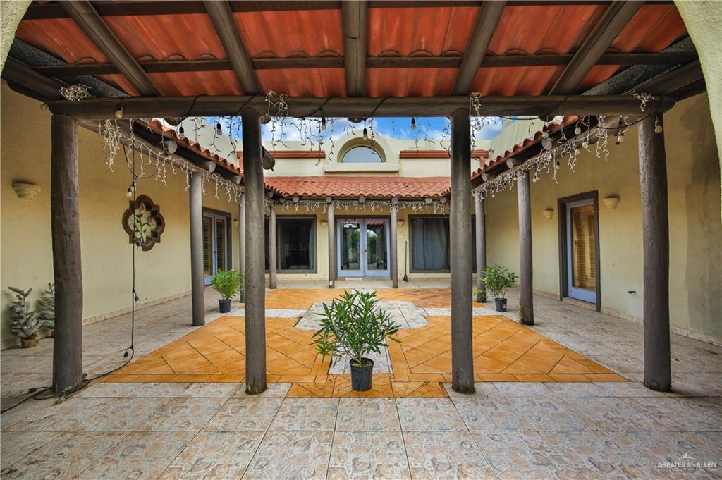 2701 Easy Street Edinburg, TX 78539 - Photo 16 of 22 a view of a porch with a table and chairs