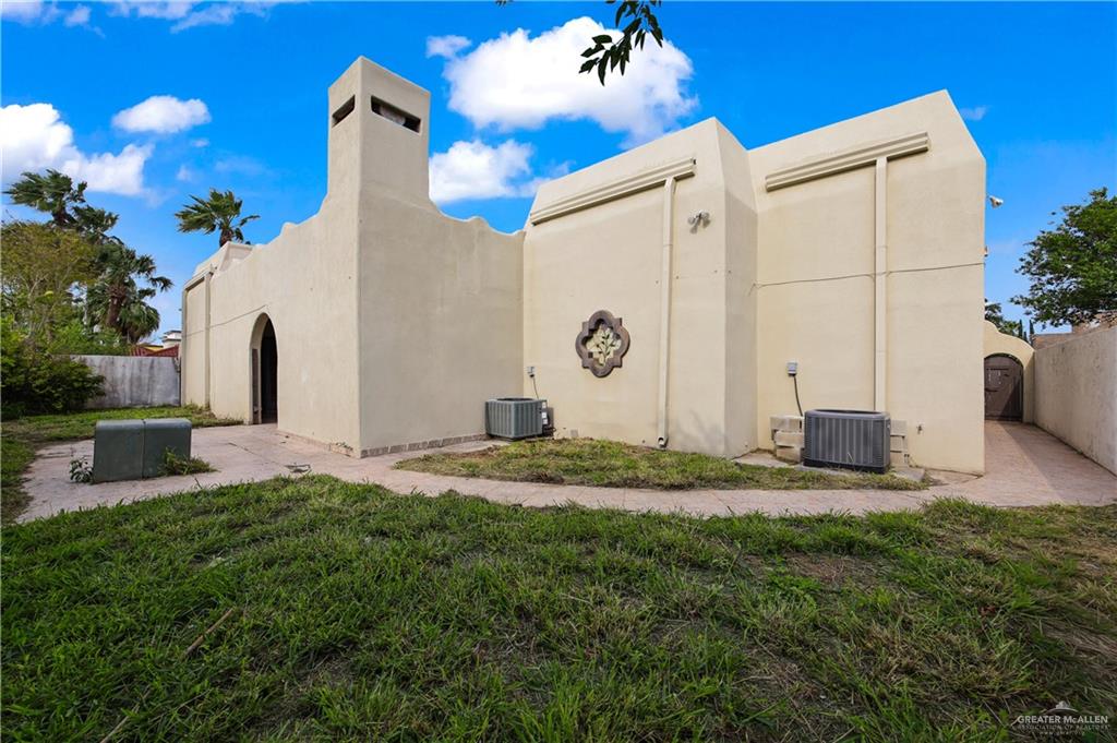 2701 Easy Street Edinburg, TX 78539 - Photo 19 of 22 a backyard of a house with fireplace and plants