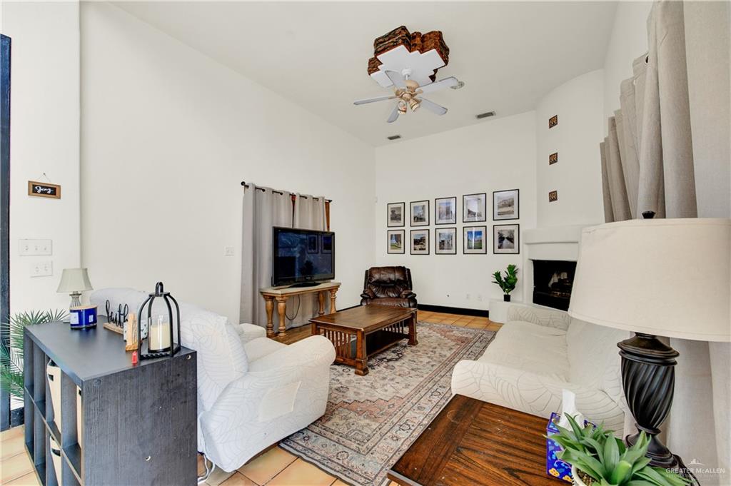 2701 Easy Street Edinburg, TX 78539 - Photo 4 of 22 a living room with furniture fireplace and flat screen tv