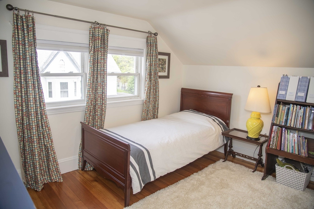 3 Chester Road, Unit 3 Belmont, MA 02478 - Photo 31 of 40 a bedroom with a bed furniture and a book shelf