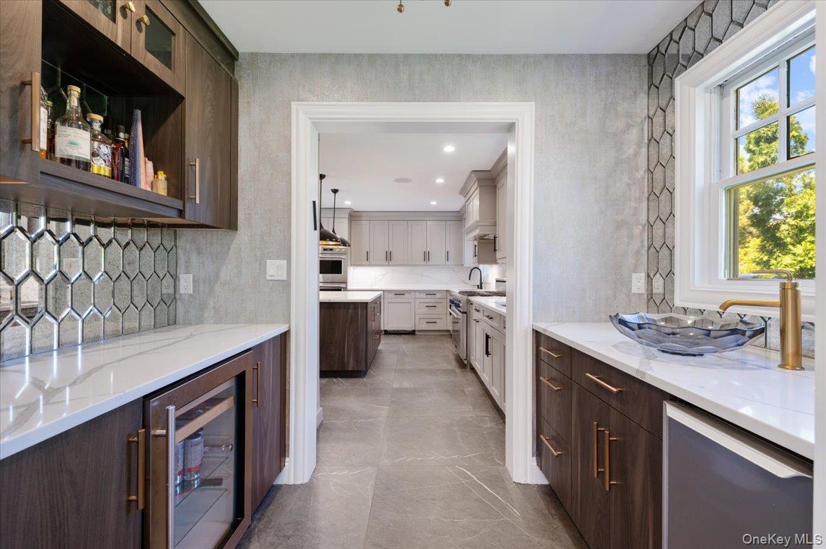 205 Hewlett Neck Road Woodmere, NY 11598 - Photo 14 of 50 a kitchen with a sink stove and cabinets