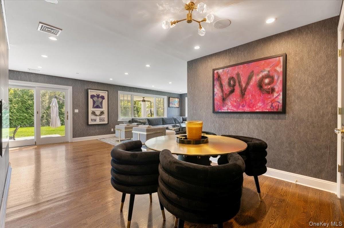 205 Hewlett Neck Road Woodmere, NY 11598 - Photo 17 of 50 a dining room with furniture and wooden floor