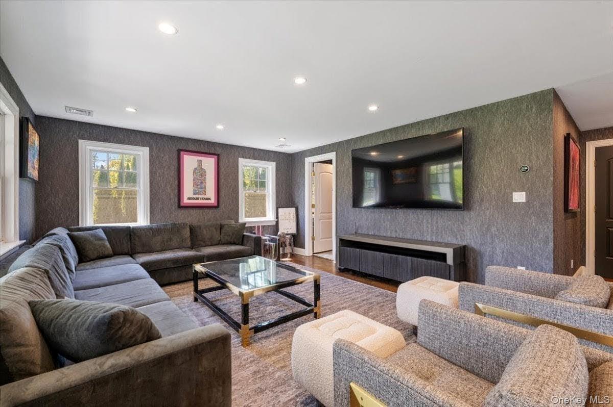 205 Hewlett Neck Road Woodmere, NY 11598 - Photo 19 of 50 a living room with furniture and a flat screen tv