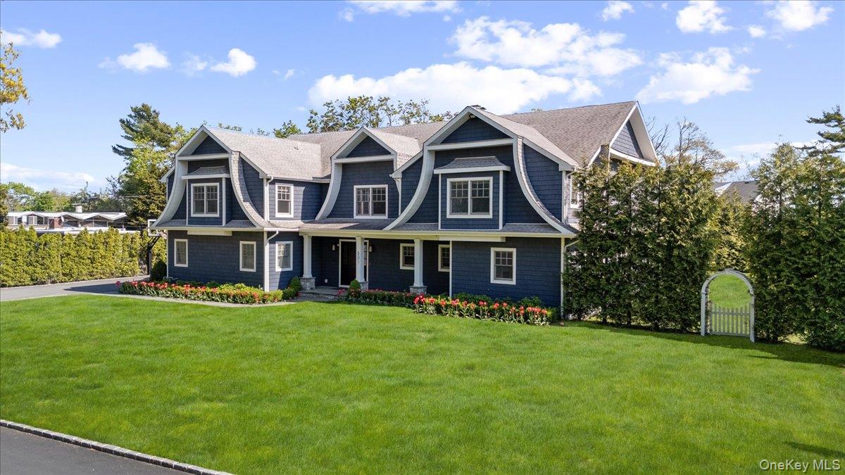 205 Hewlett Neck Road Woodmere, NY 11598 - Photo 2 of 50 a view of a house with a garden