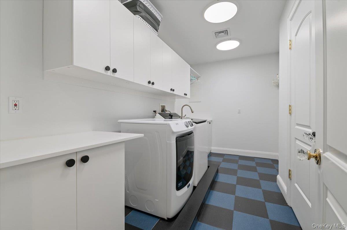 205 Hewlett Neck Road Woodmere, NY 11598 - Photo 26 of 50 a utility room with cabinets washer and dryer