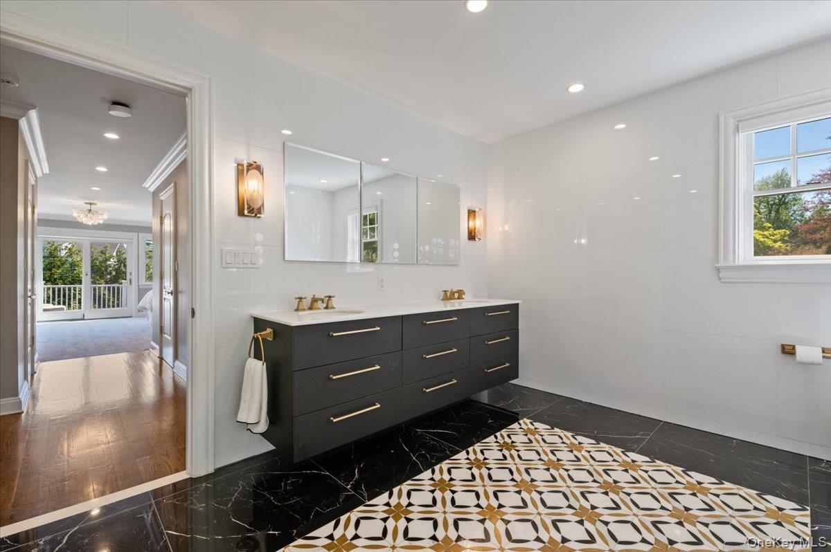 205 Hewlett Neck Road Woodmere, NY 11598 - Photo 37 of 50 a bathroom with a sink mirror and vanity