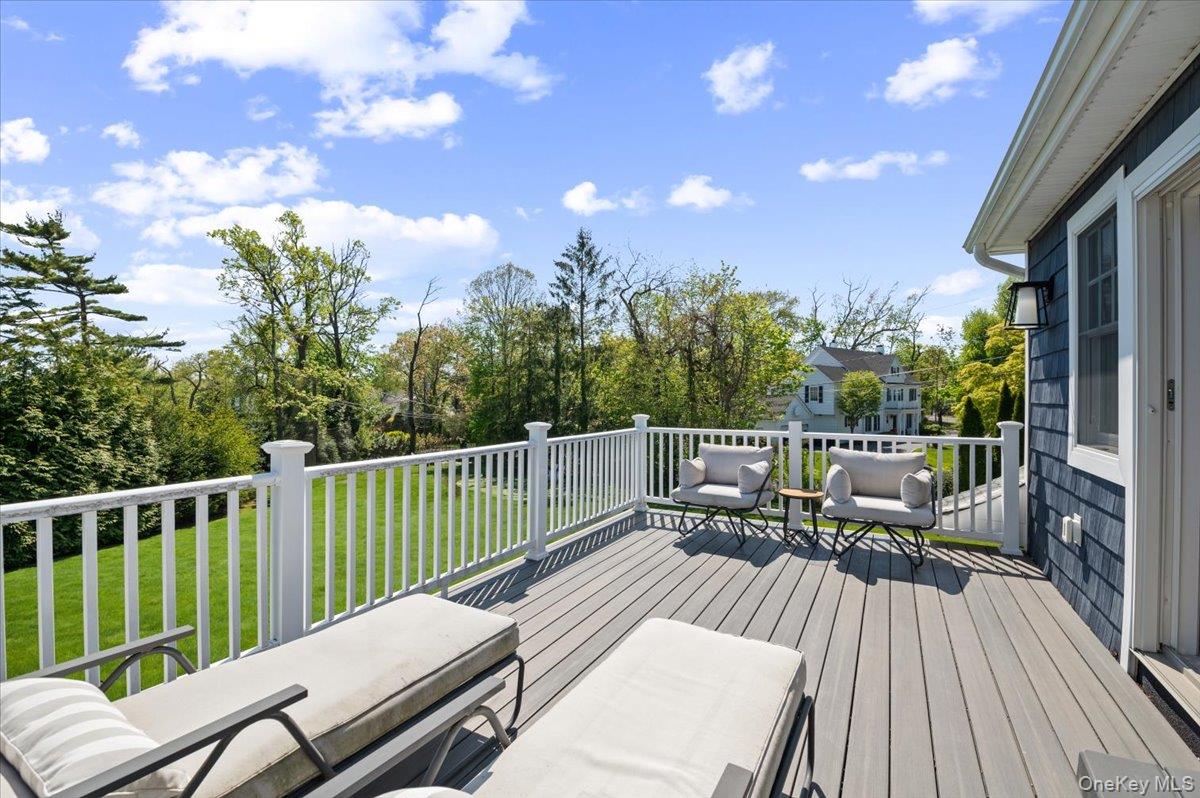 205 Hewlett Neck Road Woodmere, NY 11598 - Photo 38 of 50 a view of a balcony with wooden floor and outdoor seating
