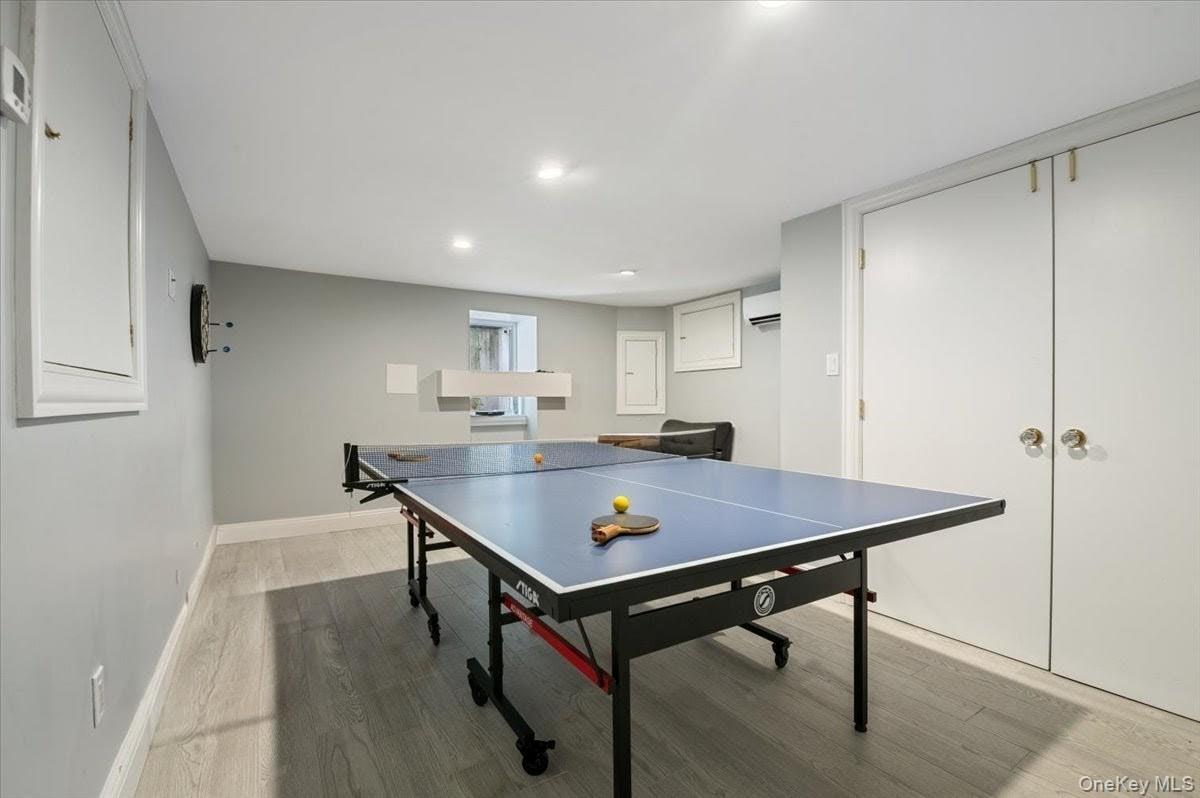 205 Hewlett Neck Road Woodmere, NY 11598 - Photo 41 of 50 a room with furniture pool table and wooden floor