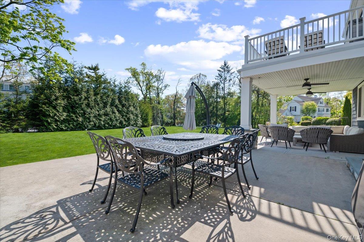 205 Hewlett Neck Road Woodmere, NY 11598 - Photo 42 of 50 a patio with table and chairs