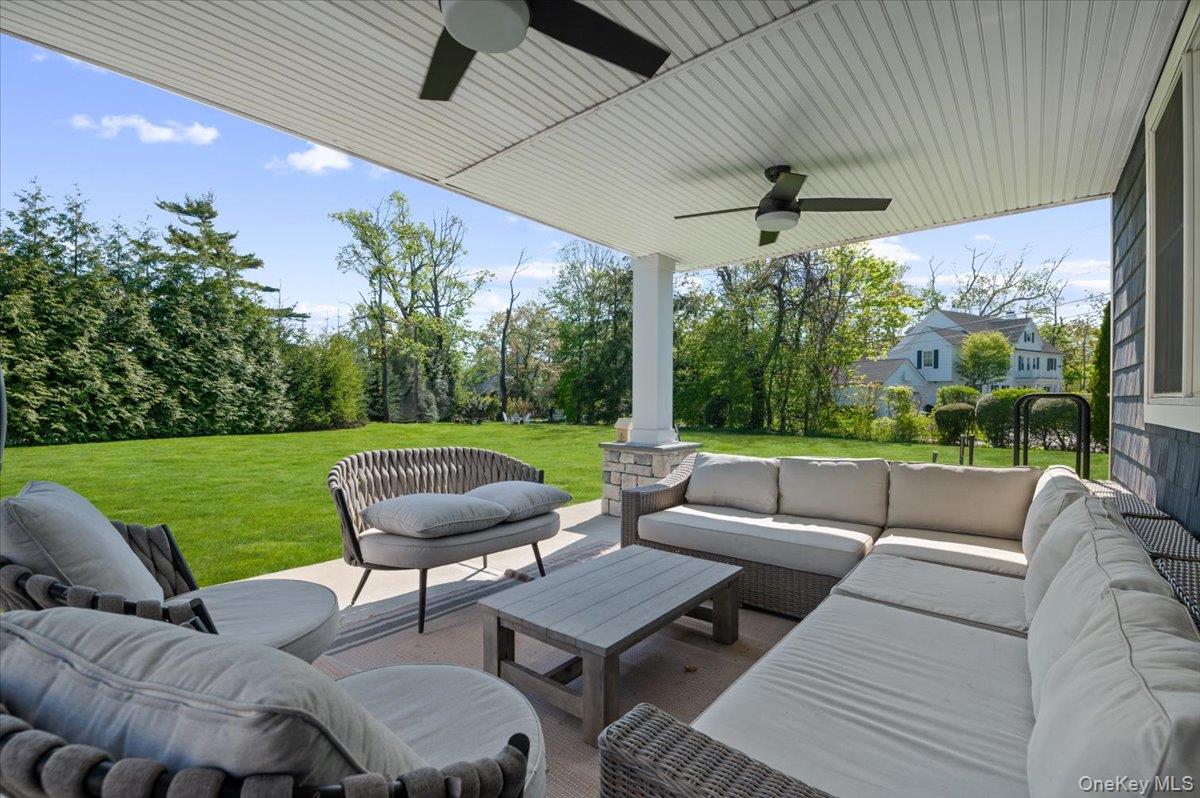 205 Hewlett Neck Road Woodmere, NY 11598 - Photo 43 of 50 a view of a patio with couches table and chairs