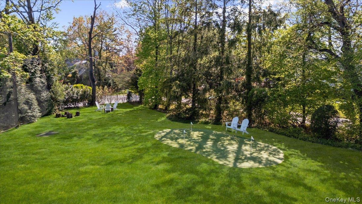 205 Hewlett Neck Road Woodmere, NY 11598 - Photo 47 of 50 a green field with lots of trees