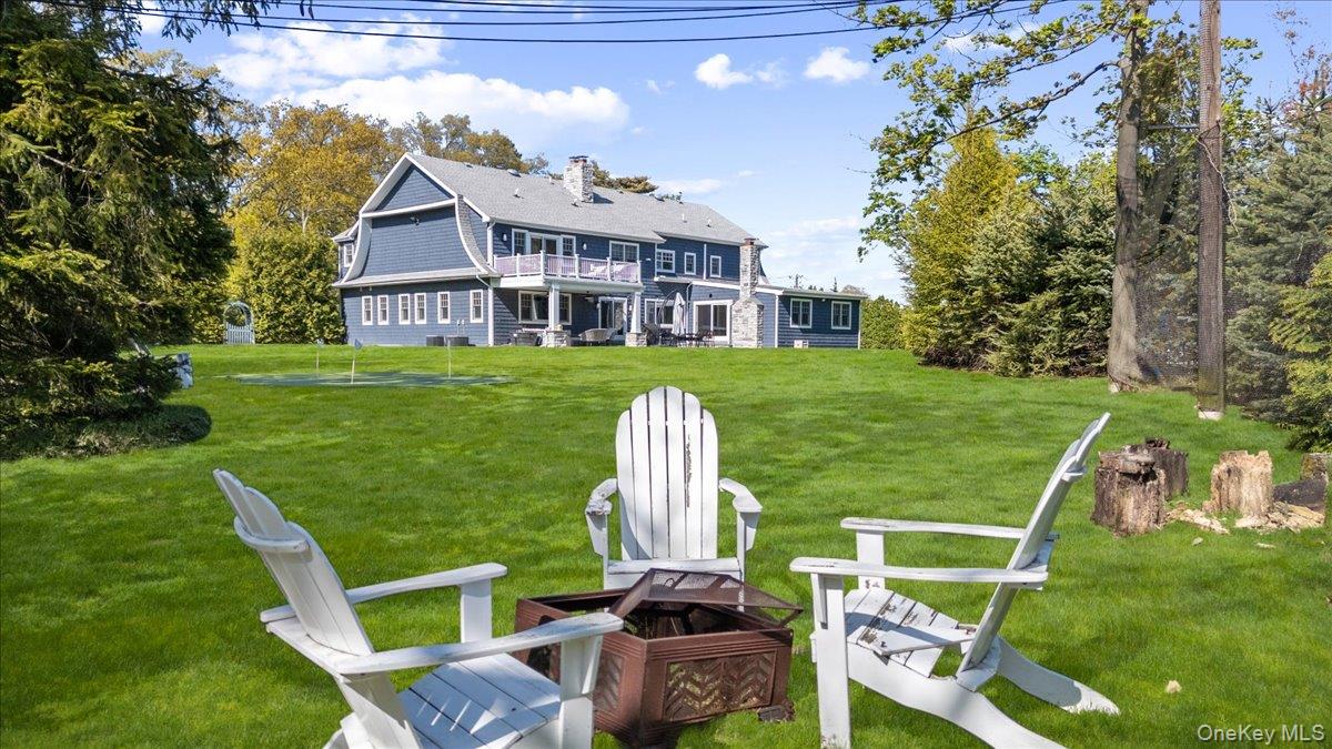 205 Hewlett Neck Road Woodmere, NY 11598 - Photo 48 of 50 a view of a chair and table in the garden