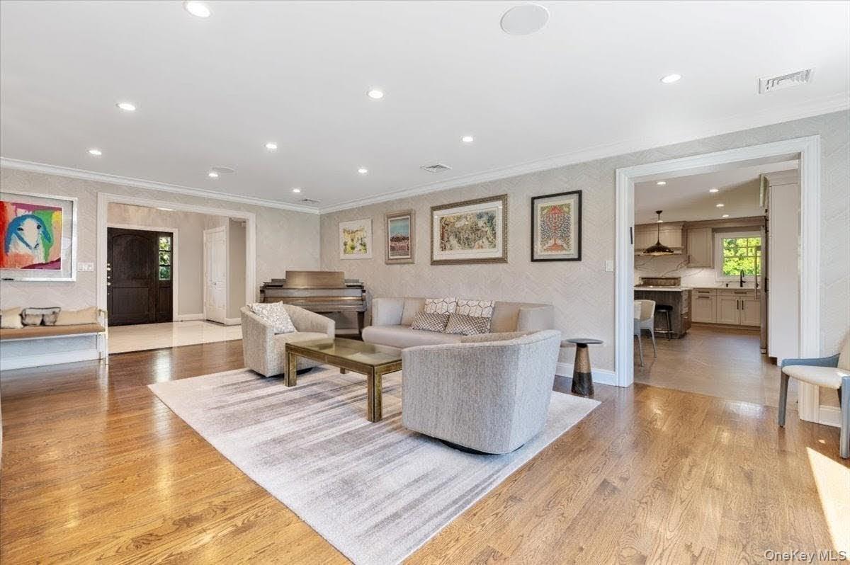 205 Hewlett Neck Road Woodmere, NY 11598 - Photo 8 of 50 a living room with furniture and a table