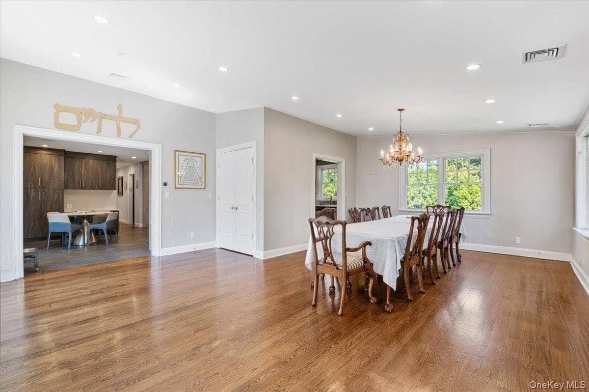 205 Hewlett Neck Road Woodmere, NY 11598 - Photo 10 of 50 a view of a dining room with furniture and wooden floor