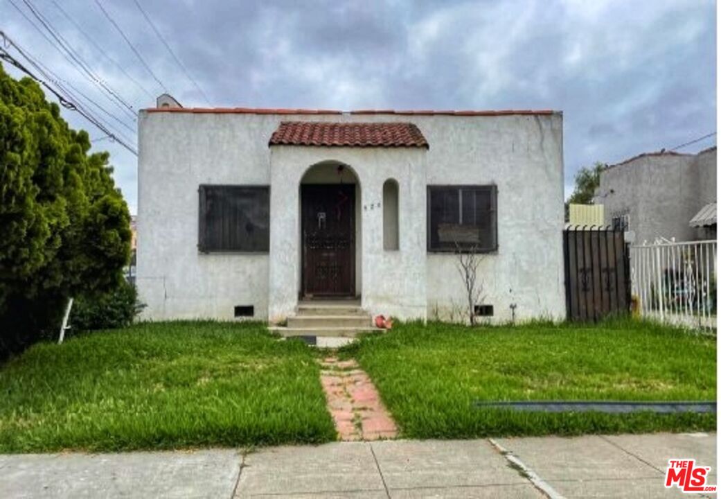 520 North Chester Avenue Compton, CA 90221 - Photo 1 of 1 a front view of a house with a yard