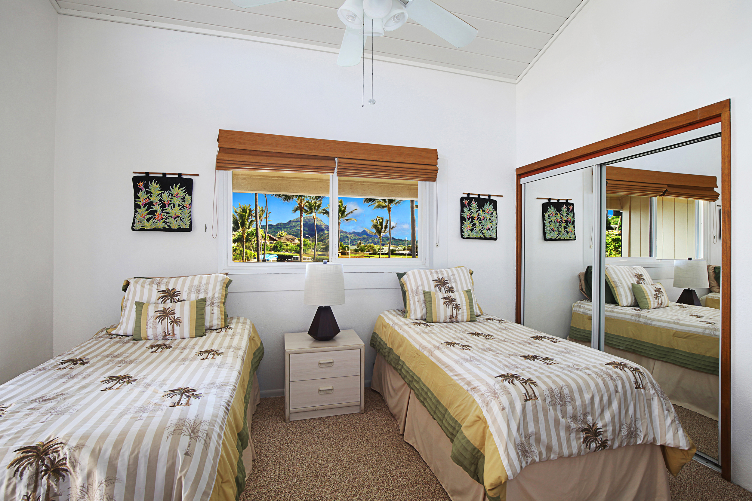 1661 Pee Road, Unit IIA312 Koloa, HI 96756 - Photo 10 of 30 a bedroom with a bed and a dresser