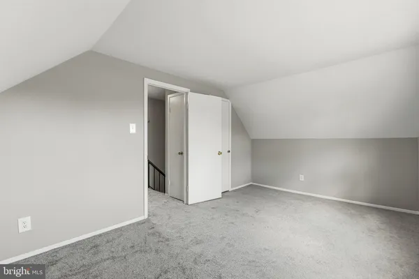 an empty room with a empty space and windows