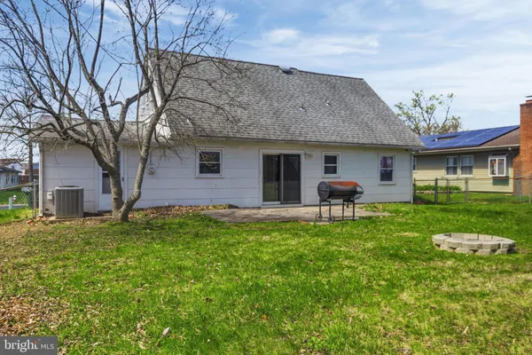 a front view of house with yard and seating area