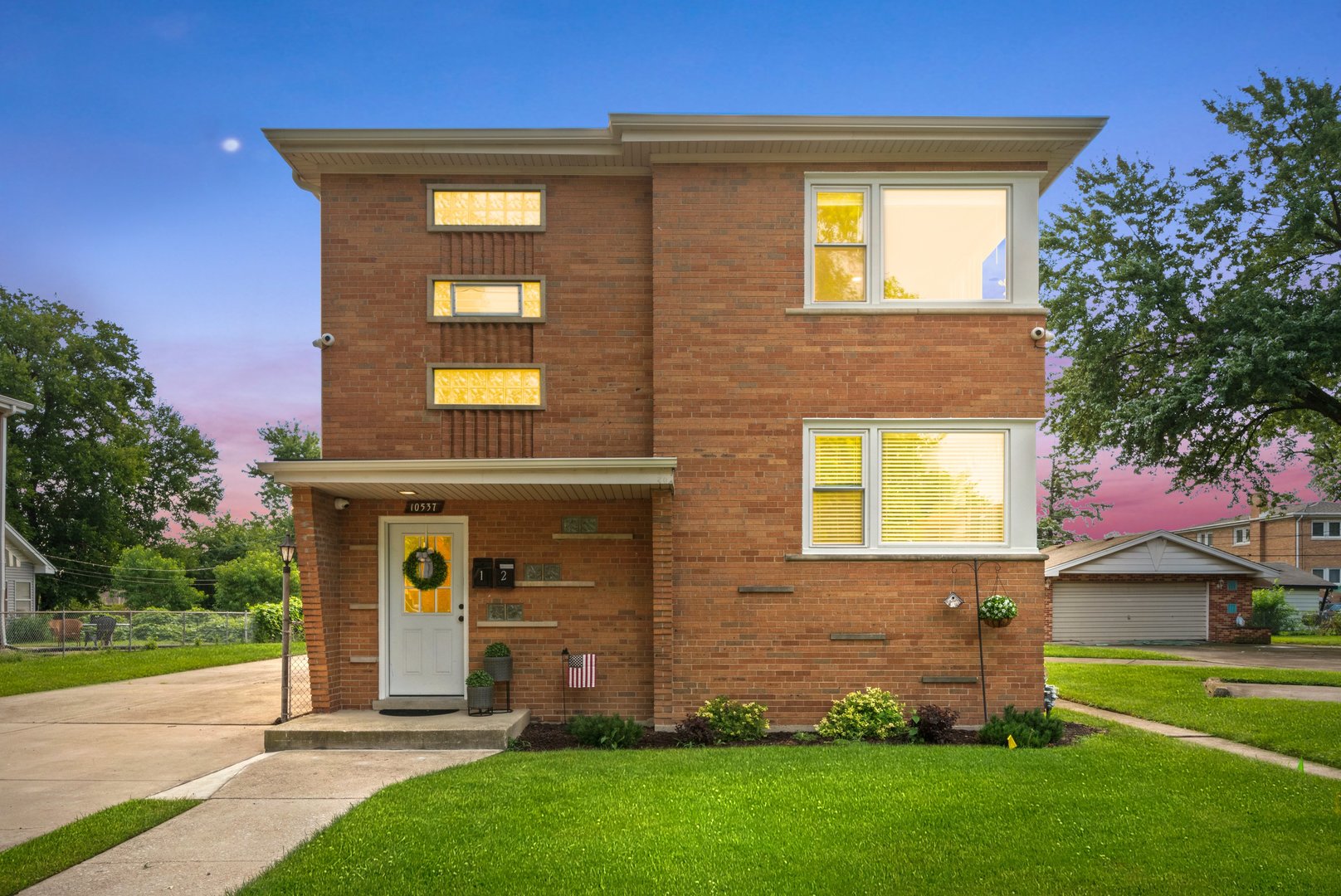 10537 Austin Avenue, Unit 2 Chicago Ridge, IL 60415 - Photo 19 of 19 front view of a house with a yard