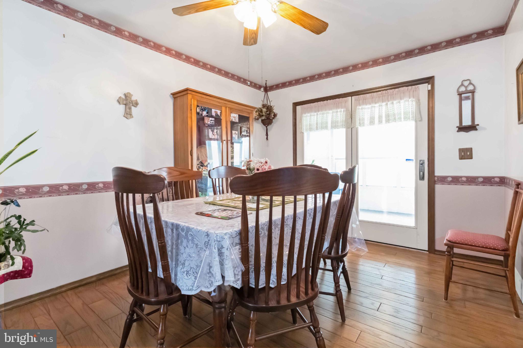 1712 Newville Road Carlisle, PA 17015 - Photo 11 of 32 a view of a dining room with furniture window and wooden floor