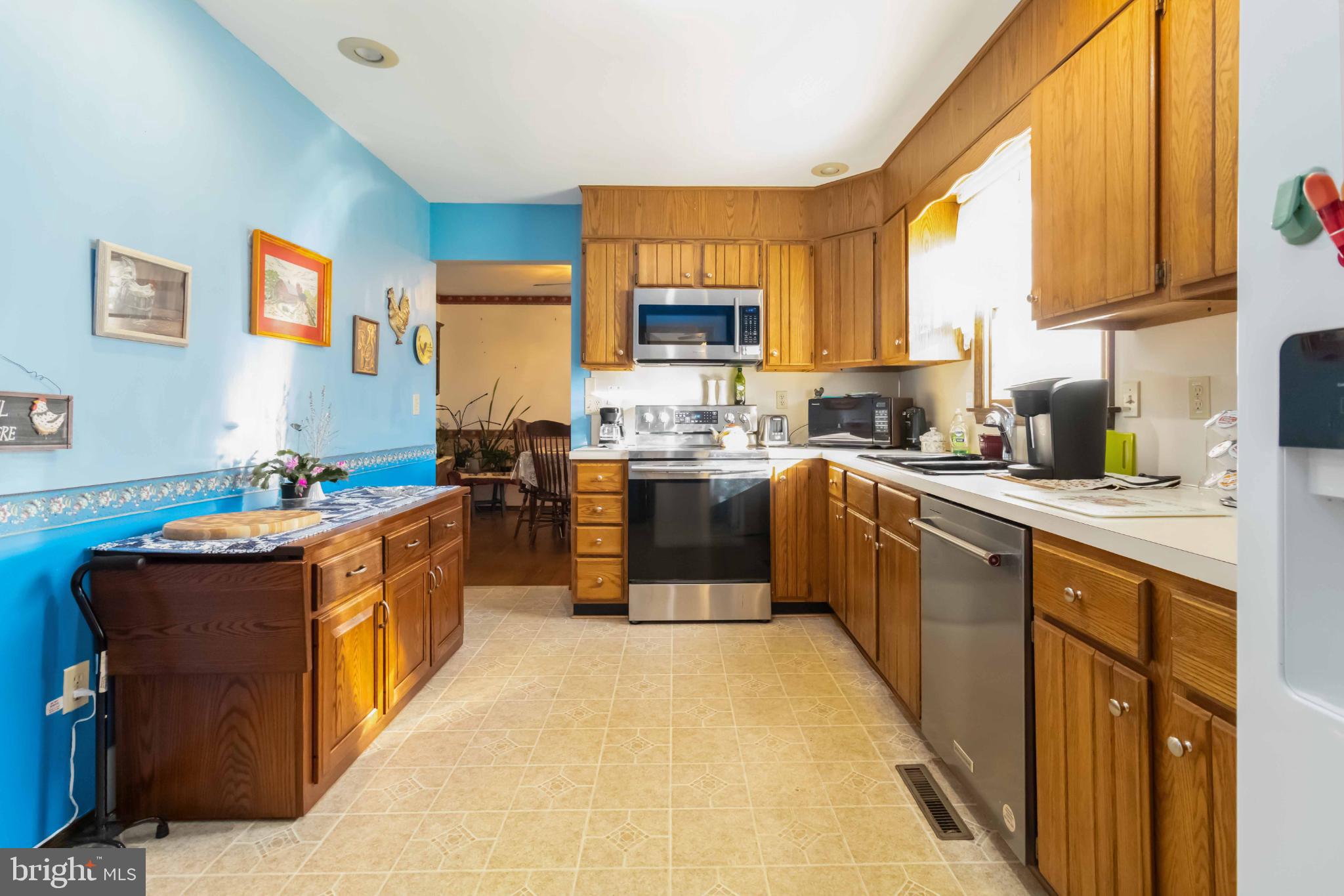 1712 Newville Road Carlisle, PA 17015 - Photo 13 of 32 a kitchen with stainless steel appliances granite countertop a stove a sink dishwasher and a refrigerator