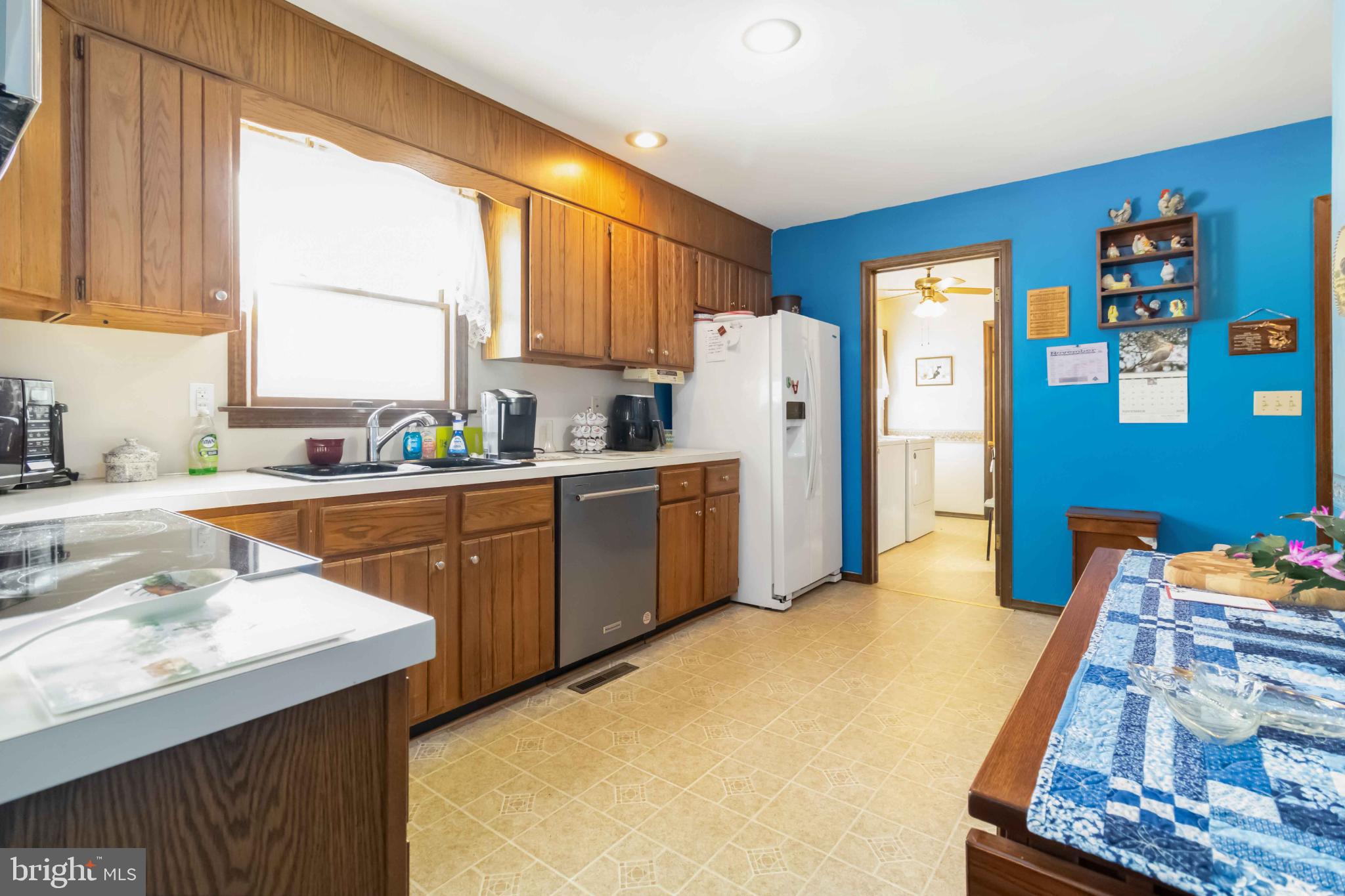1712 Newville Road Carlisle, PA 17015 - Photo 14 of 32 a kitchen with stainless steel appliances sink refrigerator and window