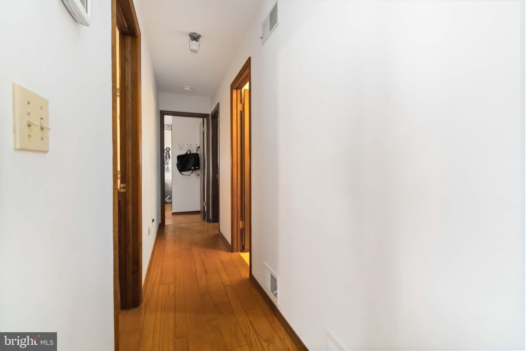 1712 Newville Road Carlisle, PA 17015 - Photo 18 of 32 a view of a hallway with wooden floor