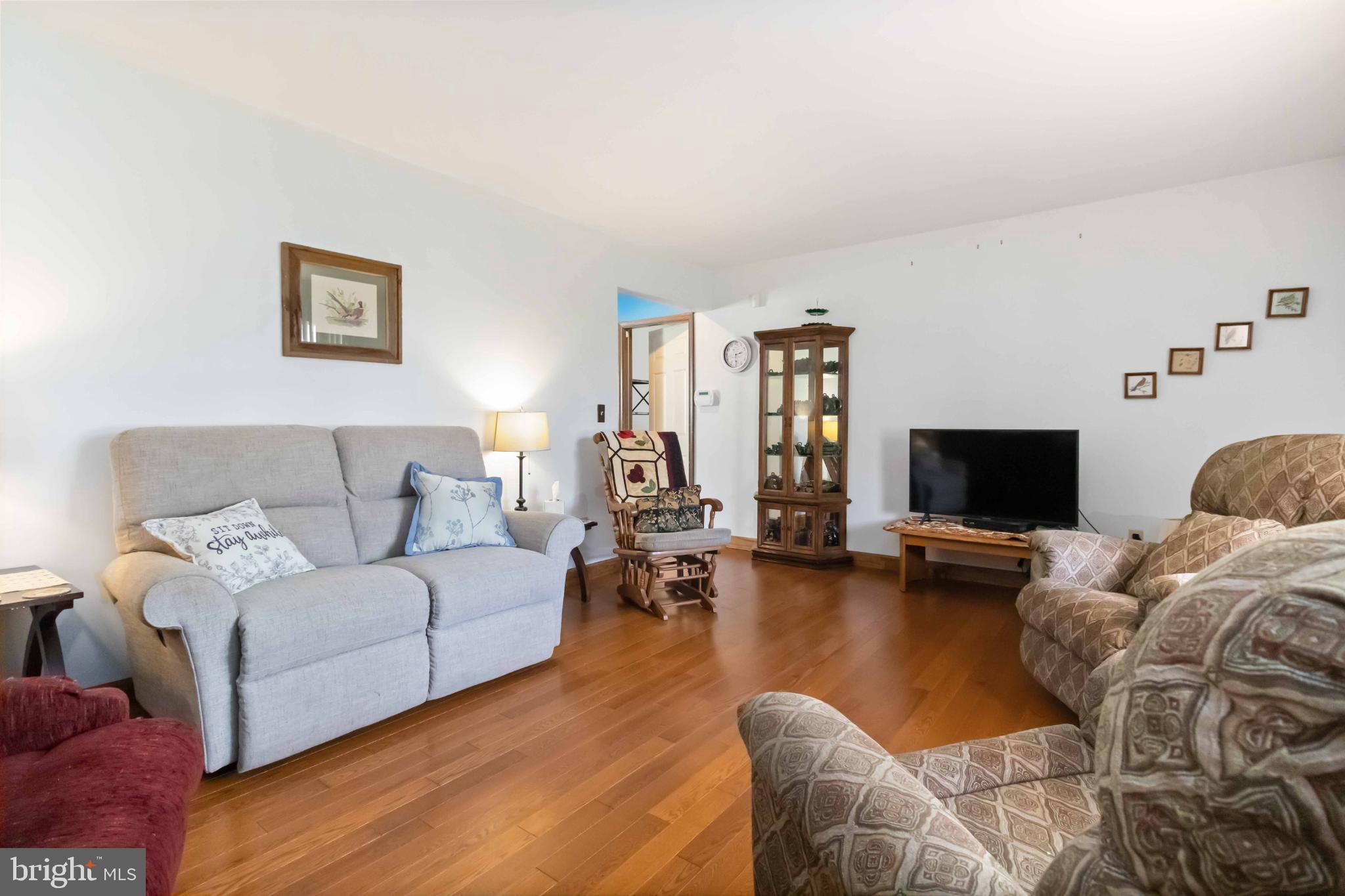1712 Newville Road Carlisle, PA 17015 - Photo 9 of 32 a living room with furniture and a flat screen tv