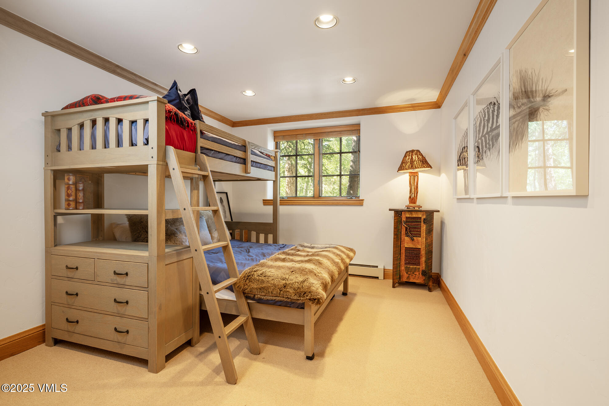 416 West Forest Road, Unit A Vail, CO 81657 - Photo 15 of 19 a bedroom with a bed and a chair in it