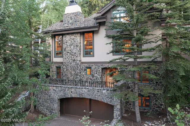 an aerial view of a house with a yard and garage