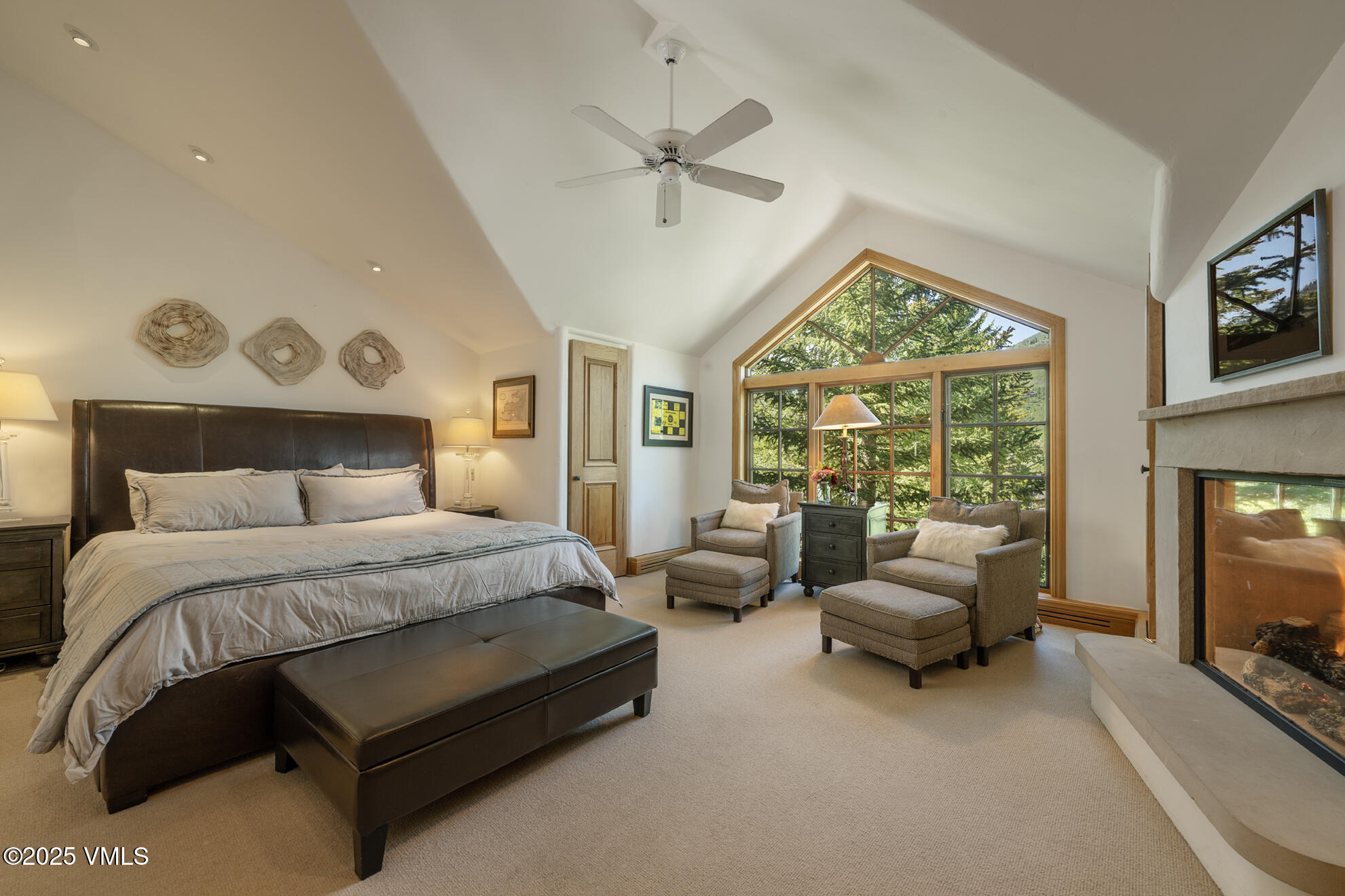 416 West Forest Road, Unit A Vail, CO 81657 - Photo 10 of 19 a bedroom with a bed couch and a large window