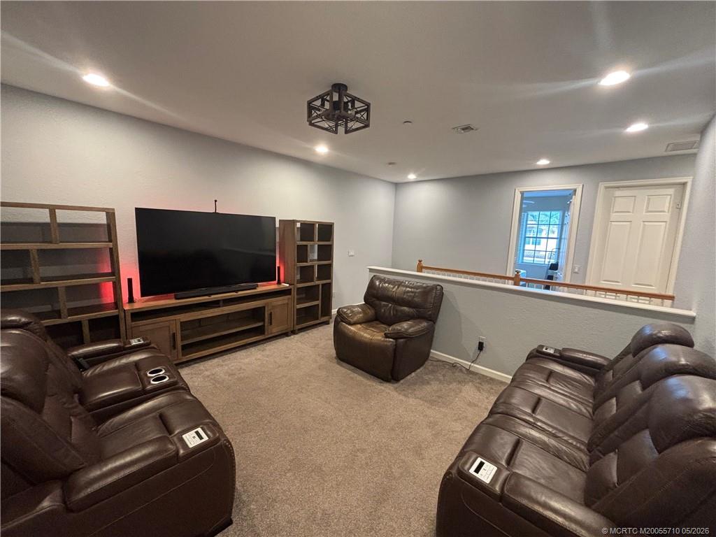 262 Southwest Walking Path, Unit 262 Stuart, FL 34997 - Photo 20 of 39 a living room with furniture and a flat screen tv