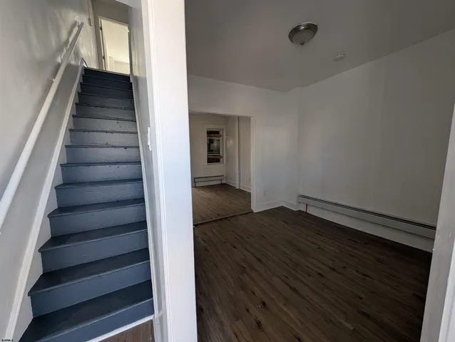 a view of entryway with wooden floor