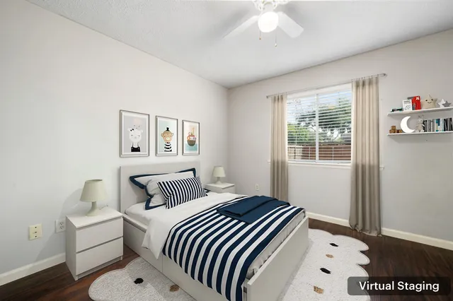 a bedroom with a bed and a window