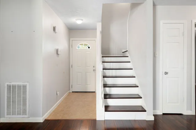 a view of entryway with wooden floor