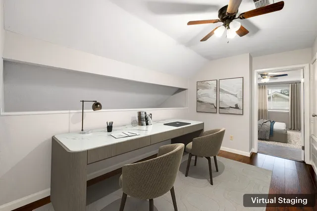 a dining room with a table and chairs