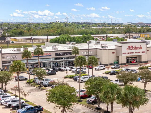 a view of a cars park in front of a building