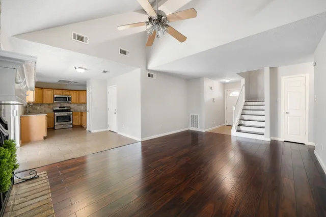 a view of kitchen with furniture and wooden floor