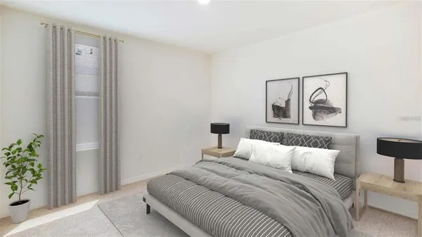 a bedroom with a bed and a painting on the wall